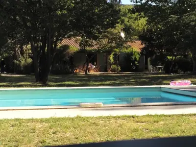 a swimming pool in the yard of a house at Lou Vergié Maison Provencale au pied du Luberon in Saint-Martin-de-Castillon