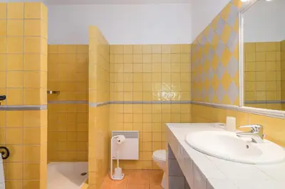 a bathroom with a sink and a toilet at Le Relais Du Grand Logis in Mirabeau