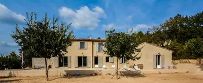 a house with two trees in front of it at Campagne Cérès in Le Puy-Sainte-Réparade