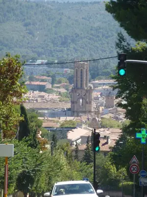 a green traffic light in front of a city at Apartment Les Muriers Blancs in Aix-en-Provence