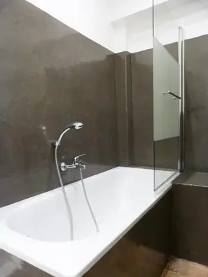 a bathroom with a shower with a glass door at Appartement coeur historique Aix in Aix-en-Provence