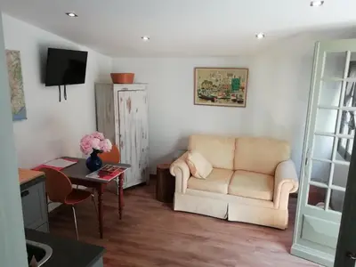 a living room with a couch and a table at Domaine Saint Jean in Saint-Saturnin-les-Apt