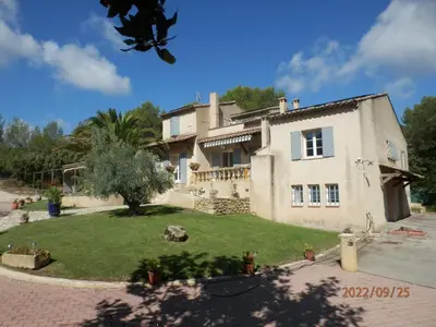 a large house with a yard in front of it at Mas les vieux chênes in Lambesc