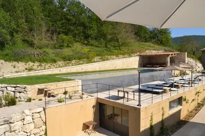 an external view of a house with a swimming pool at Mas Ste Hélène in Céreste