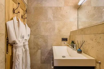 a bathroom with a sink and a shower at Domaine Les Roullets in Oppède