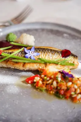 a plate of food with fish and vegetables on it at Hôtel Restaurant Mas de Fauchon - Teritoria in Saint-Cannat