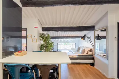 a living room with a white table and chairs at Appart Hypercentre CLIM 2chb QuartierChic in Aix-en-Provence