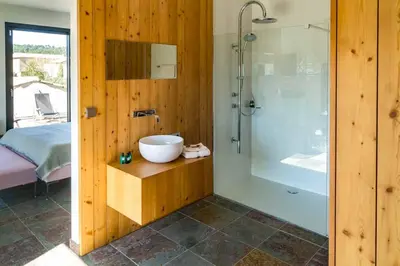 a bathroom with a sink and a shower at BB 12 LUBERON chambres d'hôtes contemporaines in Gordes