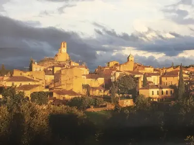 a group of buildings on top of a hill at La Calade in Lourmarin