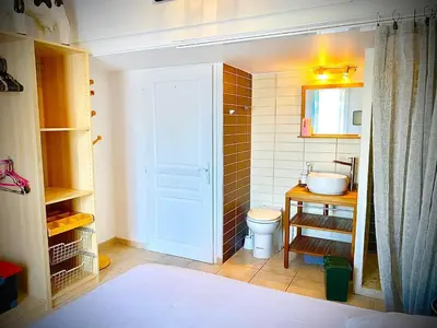 a small bathroom with a toilet and a sink at Villa Felin Feline in LʼIsle-sur-la-Sorgue
