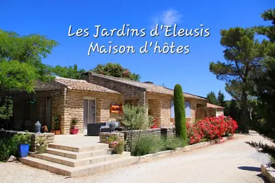 a home with a stone house with the words les tendons of himself mission d at Les Jardins d'Eleusis in Murs