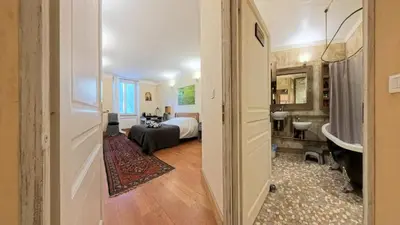 a room with a bedroom with a bed and a bathroom at Le 47 - Rentals in South of France in Beaumont-de-Pertuis