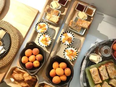a table topped with plates of food and pastries at Villa Cabrida in Cabrières-dʼAvignon