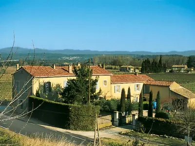 a view of a village with houses and a road at Holiday Home Le Cèdre by Interhome in Ménerbes