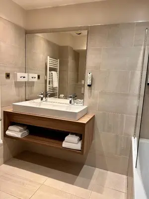 a hotel room with a bed and a television at Hôtel Rotonde Aix-en-Provence centre in Aix-en-Provence
