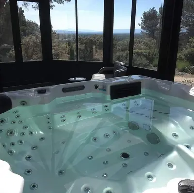 a bath tub in a room with a view at Le Bastion des Papes in Châteauneuf-de-Gadagne