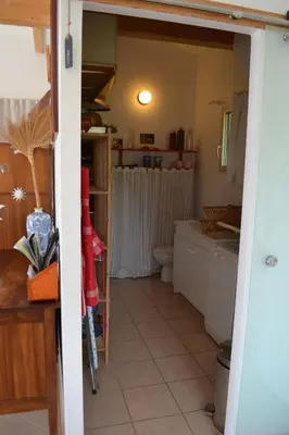 a bathroom with a toilet and a sink at Chez MiLy in Sénas