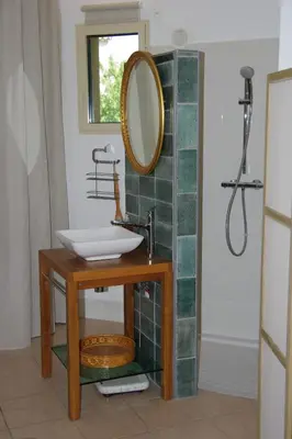 a bathroom with a sink and a mirror at Chez MiLy in Sénas