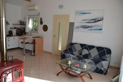 a living room with a couch and a table at Chez MiLy in Sénas
