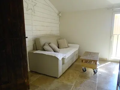 a small room with a couch and a table at le bastidon in Villars