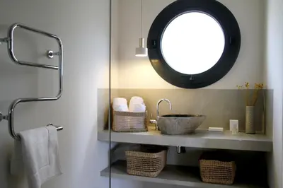 a bathroom with a sink and a mirror at Les Loges En Provence 