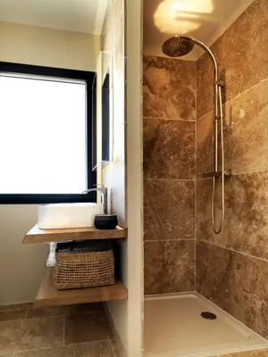 a bathroom with a shower and a sink at Les Loges En Provence 