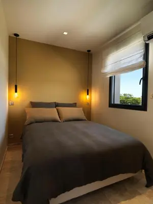 a bedroom with a large bed and a window at Les Loges En Provence 