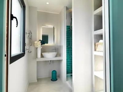 a bathroom with a sink and a mirror at Les Loges En Provence 