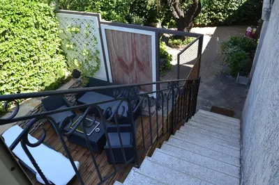 a set of stairs with a gate and a door at Pavillon de Lubéron in Lauris
