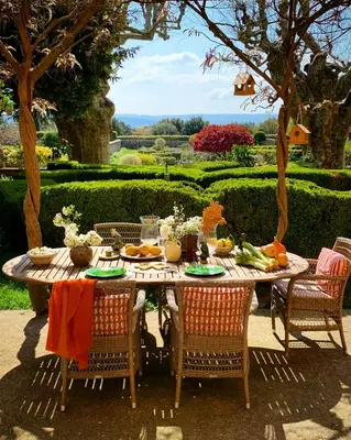 a table with food on it in a garden at Le Pavillon de Galon in Cucuron