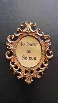 a gold picture frame with the words la dance at baloon at La Dame Au Balcon in Roussillon