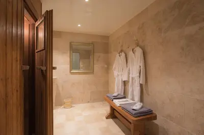 a bathroom with a walk in shower and a sink at Best Western Sévan Parc Hôtel in Pertuis