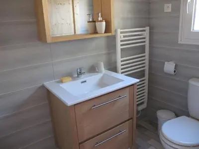 a bathroom with a sink and a toilet at L'Oustau de Bigatié in Lambesc