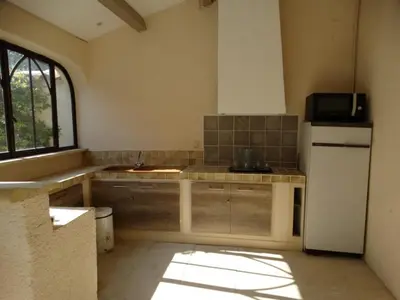 a kitchen with a sink and a refrigerator at L'Oustau de Bigatié in Lambesc