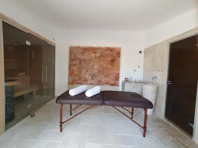 a room with a table in the middle of a kitchen at Mas au Cœur de La Provence & SPA in Saint-Cannat
