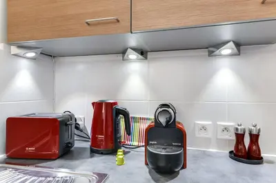 a kitchen counter top with a toaster and a toaster at Appartement de caractère entre St Rémy et Avignon, 74m2, 2 à 4 personnes in Noves