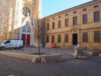 a white van parked in front of a building at APPART AIX MAZARIN in Aix-en-Provence