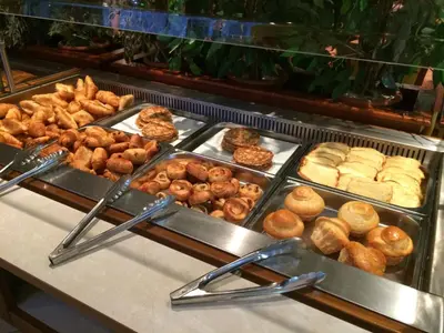 a bunch of different types of donuts and pastries at Hôtellerie Notre Dame de Lumières in Goult