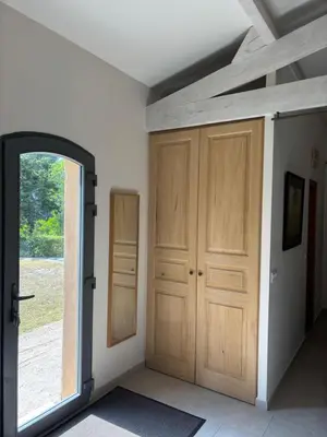 an empty room with a door and a window at le Mas des Pignes -adults only in Aix-en-Provence