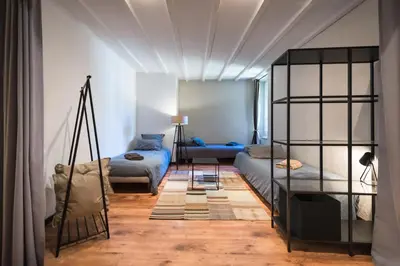 a living room with two beds and a couch at Su Lei Campanes in Lauris