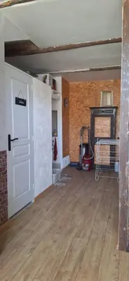 an empty room with a white door and a fireplace at Gîte Mas de la Restanque in Monteux