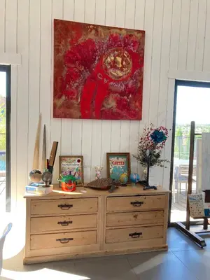 a wooden dresser in a room with a painting on the wall at Belle villa en Provence in Lançon-Provence