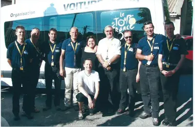 a group of people standing in front of a bus at Hôtel Le Siècle in Mazan