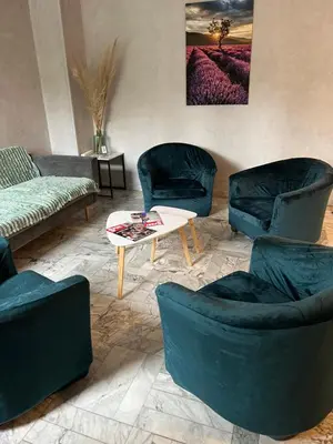 a group of chairs and a table in a yard at Adonis Arc Hotel Aix in Aix-en-Provence