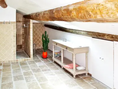 a bathroom with a sink and a bath tub at Maison de charme à Mollégès avec piscine privée in Mollégès