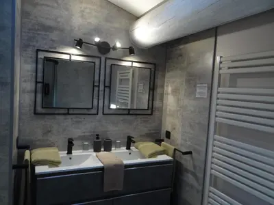 a bathroom with two sinks and a mirror at Mas Val-Chênaie Gordes in Gordes