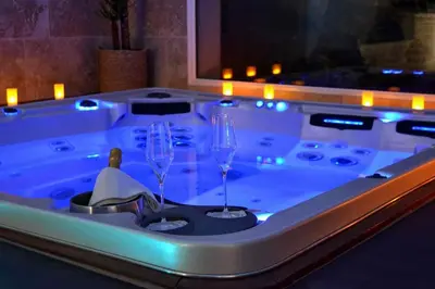 a bath tub with two wine glasses in it at L instant Magique in Beaumont-de-Pertuis