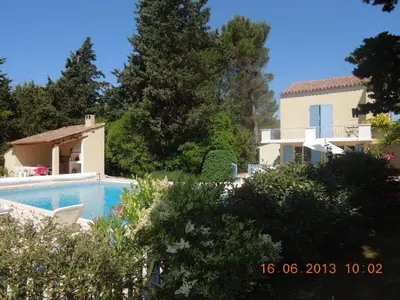 a view of a house and a swimming pool at Villa - La Luberonne in Lourmarin