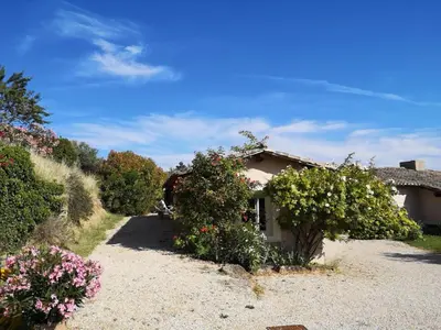 a small house with flowers in front of it at The Neame House in Bédoin