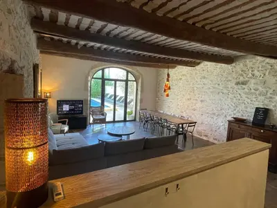 a living room with a couch and a table at Le Mas du Félibre in Caumont-sur-Durance